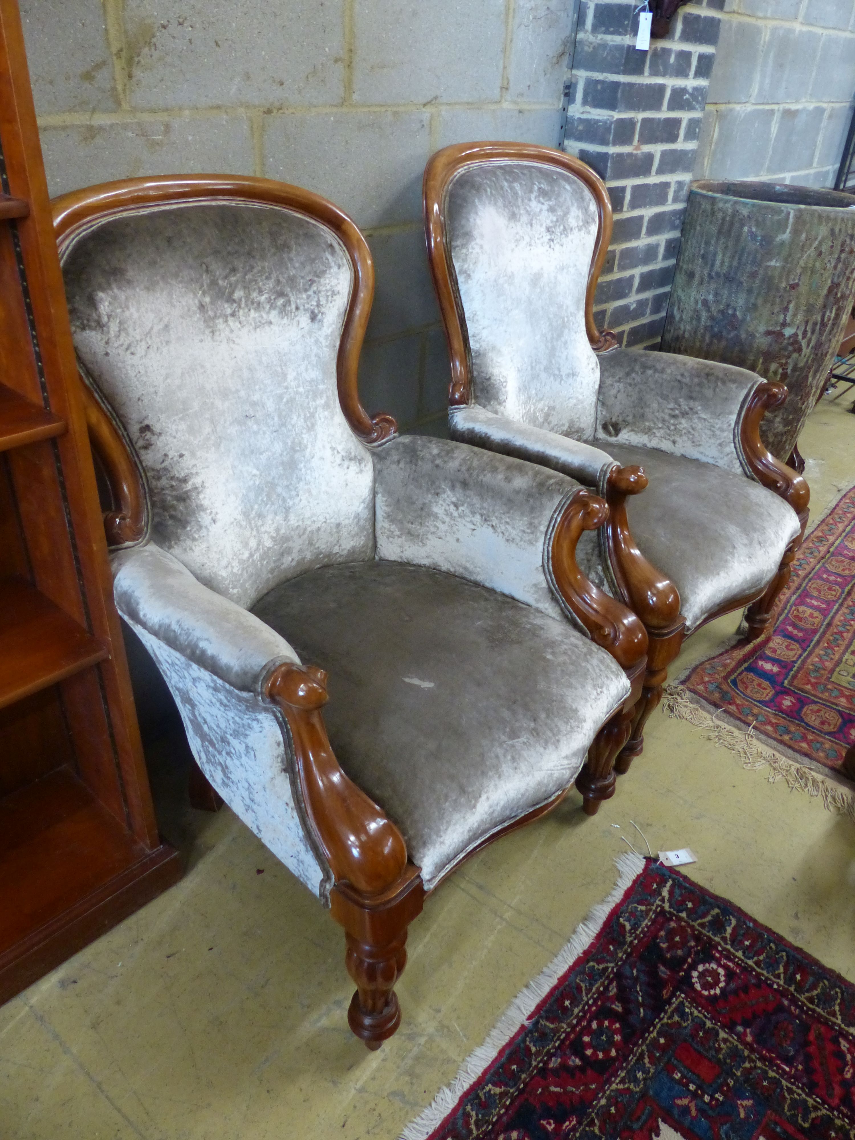 A pair of reproduction Victorian style mahogany spoonback armchairs, width 71cm depth 80cm height 108cm